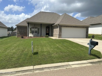 This METICULOUSLY maintained home features a welcoming front on Castlewoods Golf Club in Mississippi - for sale on GolfHomes.com, golf home, golf lot