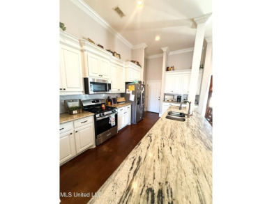 This METICULOUSLY maintained home features a welcoming front on Castlewoods Golf Club in Mississippi - for sale on GolfHomes.com, golf home, golf lot