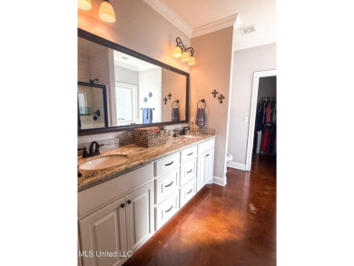 This METICULOUSLY maintained home features a welcoming front on Castlewoods Golf Club in Mississippi - for sale on GolfHomes.com, golf home, golf lot