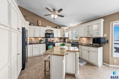 This south-side stunner sits on an oversized, private lot and on Prairie Green Golf Course in South Dakota - for sale on GolfHomes.com, golf home, golf lot