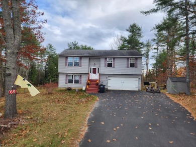 This 2003 raised ranch in Hermon offers a blend of modern on Hermon Meadow Golf Club in Maine - for sale on GolfHomes.com, golf home, golf lot