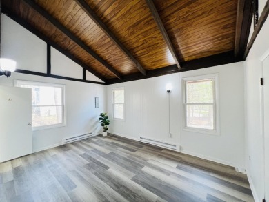 Escape to the Poconos in this beautifully updated 3-bedroom on Pocono Farms Country Club in Pennsylvania - for sale on GolfHomes.com, golf home, golf lot