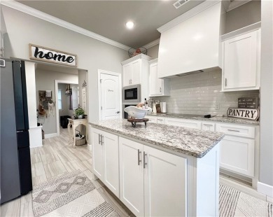 Built in 2022, this beautifully designed 3-bedroom, 2-bath home on Bella Vista Country Club - Highlands in Arkansas - for sale on GolfHomes.com, golf home, golf lot