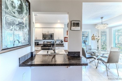 The POND Views are amazing at this beautifully updated, end unit on Timber Pines Golf Course in Florida - for sale on GolfHomes.com, golf home, golf lot