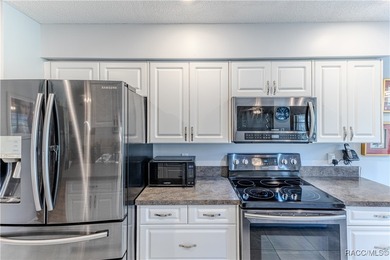 The POND Views are amazing at this beautifully updated, end unit on Timber Pines Golf Course in Florida - for sale on GolfHomes.com, golf home, golf lot