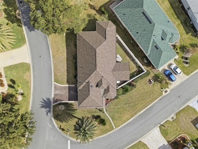 This concrete block/stucco home boasts a new roof and gutters in on Monarch At Royal Highlands in Florida - for sale on GolfHomes.com, golf home, golf lot