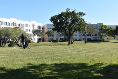 Bright and spacious 2BR/2BA corner unit with views of the on Sunrise Lakes Phase IV Golf Course in Florida - for sale on GolfHomes.com, golf home, golf lot