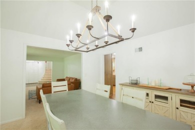 Spacious 4 bedroom, 4.5 bath side-to-side split located in a on Leawood South Country Club in Kansas - for sale on GolfHomes.com, golf home, golf lot