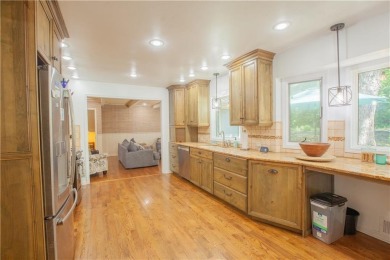 Spacious 4 bedroom, 4.5 bath side-to-side split located in a on Leawood South Country Club in Kansas - for sale on GolfHomes.com, golf home, golf lot