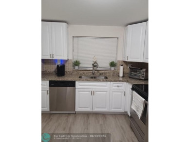 Breathtaking view of Serene Lake, charming 2/2. Modern kitchen on Sunrise Lakes Phase III in Florida - for sale on GolfHomes.com, golf home, golf lot