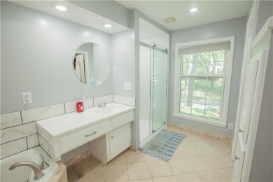 Spacious 4 bedroom, 4.5 bath side-to-side split located in a on Leawood South Country Club in Kansas - for sale on GolfHomes.com, golf home, golf lot