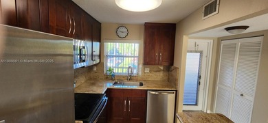 Turnkey, Just Painted 2 bed 2 bath 2 walk-ins double pantry 2 on Sunrise Lakes Phase IV Golf Course in Florida - for sale on GolfHomes.com, golf home, golf lot