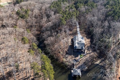 This exceptional waterfront property on Lake Tillery offers on The Tillery Tradition Country Club in North Carolina - for sale on GolfHomes.com, golf home, golf lot