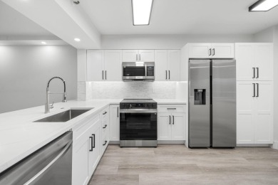 Step into luxury in this fully remodeled 2-bed, 2-bath corner on Marina Lakes Golf Course in Florida - for sale on GolfHomes.com, golf home, golf lot