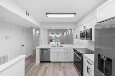 Step into luxury in this fully remodeled 2-bed, 2-bath corner on Marina Lakes Golf Course in Florida - for sale on GolfHomes.com, golf home, golf lot