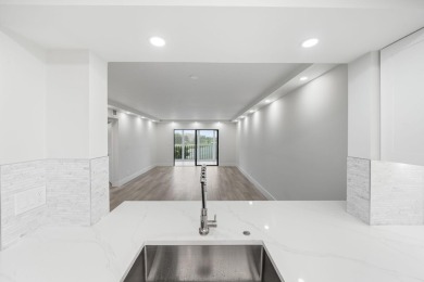 Step into luxury in this fully remodeled 2-bed, 2-bath corner on Marina Lakes Golf Course in Florida - for sale on GolfHomes.com, golf home, golf lot