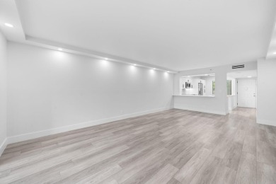 Step into luxury in this fully remodeled 2-bed, 2-bath corner on Marina Lakes Golf Course in Florida - for sale on GolfHomes.com, golf home, golf lot