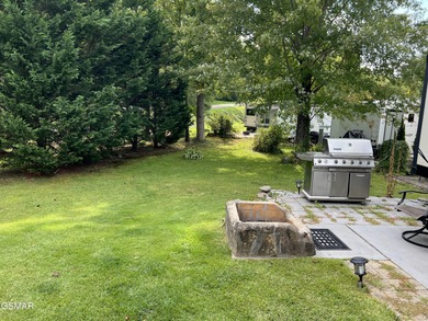Nice RV lot with plenty of trees, nice patio, and firepit area on Bent Creek Golf Course in Tennessee - for sale on GolfHomes.com, golf home, golf lot