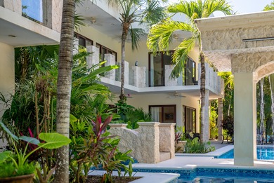 The villa consists of a main house and guesthouse, and is built on Bahia Principe Riviera Maya Golf Course in  - for sale on GolfHomes.com, golf home, golf lot