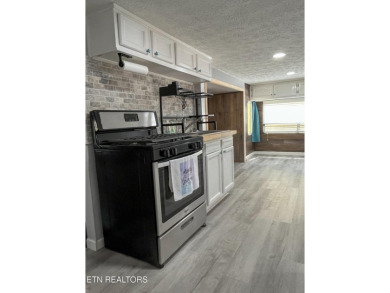 Charming 1 Bedroom Retreat in Holiday Out RV Park on creek with on Lake Tansi Village Country Club in Tennessee - for sale on GolfHomes.com, golf home, golf lot