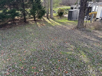 Nice RV lot with plenty of trees, nice patio, and firepit area on Bent Creek Golf Course in Tennessee - for sale on GolfHomes.com, golf home, golf lot