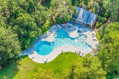 Nestled under a canopy of centuries old Angel Live Oak trees on Willbrook Plantation Golf Club in South Carolina - for sale on GolfHomes.com, golf home, golf lot