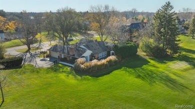 Experience resort-style living with serene, year-round views of on Forest Lake Country Club in Michigan - for sale on GolfHomes.com, golf home, golf lot