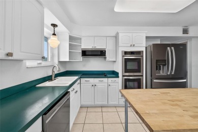 Presenting this custom-built residence overlooking the tranquil on North Lakes Golf Course in Florida - for sale on GolfHomes.com, golf home, golf lot