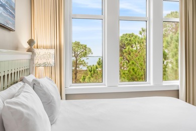 Experience breathtaking bay views and refined coastal luxury in on Sandestin Golf and Beach Resort - Raven in Florida - for sale on GolfHomes.com, golf home, golf lot