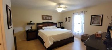 Lovely second floor furnished 2 bedroom, 2 bath, split plan on Tarpon Woods Golf Club in Florida - for sale on GolfHomes.com, golf home, golf lot