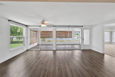Presenting this custom-built residence overlooking the tranquil on North Lakes Golf Course in Florida - for sale on GolfHomes.com, golf home, golf lot