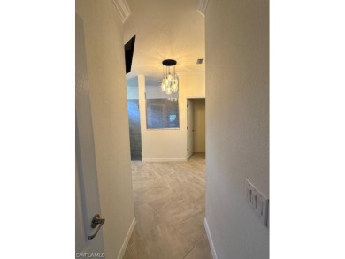 All Impact Windows, custom pool home is on a corner lot with a on Gateway Golf and Country Club in Florida - for sale on GolfHomes.com, golf home, golf lot