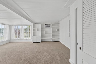 Presenting this custom-built residence overlooking the tranquil on North Lakes Golf Course in Florida - for sale on GolfHomes.com, golf home, golf lot