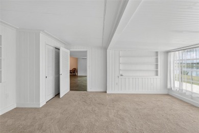 Presenting this custom-built residence overlooking the tranquil on North Lakes Golf Course in Florida - for sale on GolfHomes.com, golf home, golf lot