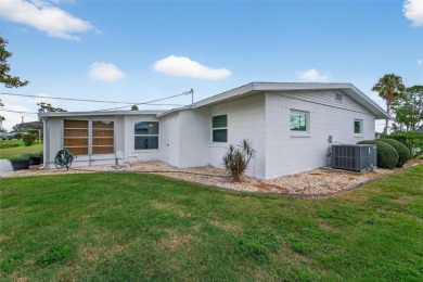 Presenting this custom-built residence overlooking the tranquil on North Lakes Golf Course in Florida - for sale on GolfHomes.com, golf home, golf lot