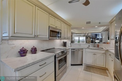 DONT MISS OUT ON THIS STUNNING RENOVATED 1900 SQ FT CORNER on Boca Dunes Golf and Country Club in Florida - for sale on GolfHomes.com, golf home, golf lot