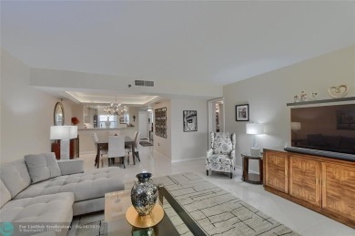DONT MISS OUT ON THIS STUNNING RENOVATED 1900 SQ FT CORNER on Boca Dunes Golf and Country Club in Florida - for sale on GolfHomes.com, golf home, golf lot