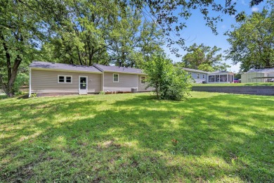 Welcome home! Adorable ranch home across from Blank Park Zoo and on A H Blank Municipal Course in Iowa - for sale on GolfHomes.com, golf home, golf lot