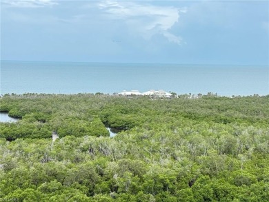 Imagine waking up to the vibrant hues of sunrise painting the on Club at Pelican Bay Golf Course in Florida - for sale on GolfHomes.com, golf home, golf lot