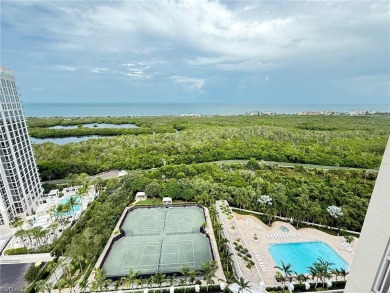 Imagine waking up to the vibrant hues of sunrise painting the on Club at Pelican Bay Golf Course in Florida - for sale on GolfHomes.com, golf home, golf lot