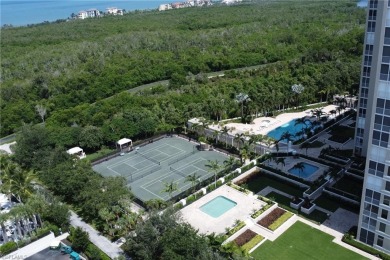 Imagine waking up to the vibrant hues of sunrise painting the on Club at Pelican Bay Golf Course in Florida - for sale on GolfHomes.com, golf home, golf lot