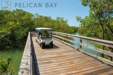 Imagine waking up to the vibrant hues of sunrise painting the on Club at Pelican Bay Golf Course in Florida - for sale on GolfHomes.com, golf home, golf lot
