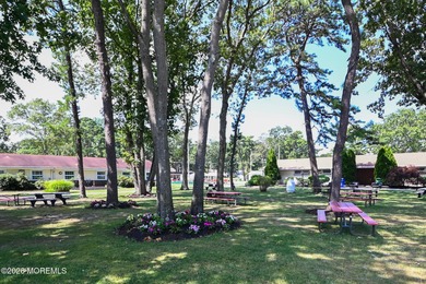 This 2-bedroom, 1-bath Upper Level Lancaster model offers a on Greenbriar Woodlands in New Jersey - for sale on GolfHomes.com, golf home, golf lot