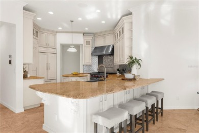 This home is a true SHOWSTOPPER, blending timeless elegance with on Westchase Golf Club in Florida - for sale on GolfHomes.com, golf home, golf lot
