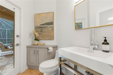 This home is a true SHOWSTOPPER, blending timeless elegance with on Westchase Golf Club in Florida - for sale on GolfHomes.com, golf home, golf lot