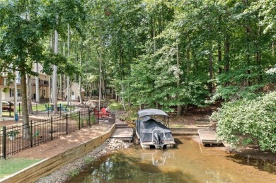 Lake Access and Private Dock! This Charming Lakeside Retreat is on The Highlands Course at Lake Arrowhead in Georgia - for sale on GolfHomes.com, golf home, golf lot