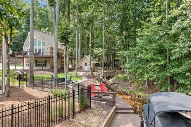 Lake Access and Private Dock! This Charming Lakeside Retreat is on The Highlands Course at Lake Arrowhead in Georgia - for sale on GolfHomes.com, golf home, golf lot
