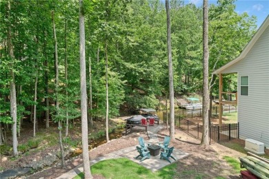 Lake Access and Private Dock! This Charming Lakeside Retreat is on The Highlands Course at Lake Arrowhead in Georgia - for sale on GolfHomes.com, golf home, golf lot