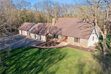 Welcome home to this stunning 5-bedroom, 4-bathroom residence - on Elk River Golf Club in Minnesota - for sale on GolfHomes.com, golf home, golf lot