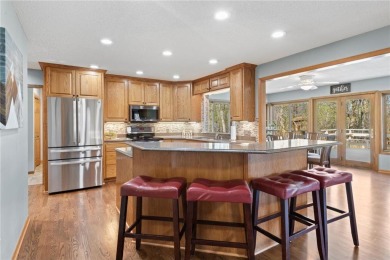 Welcome home to this stunning 5-bedroom, 4-bathroom residence - on Elk River Golf Club in Minnesota - for sale on GolfHomes.com, golf home, golf lot